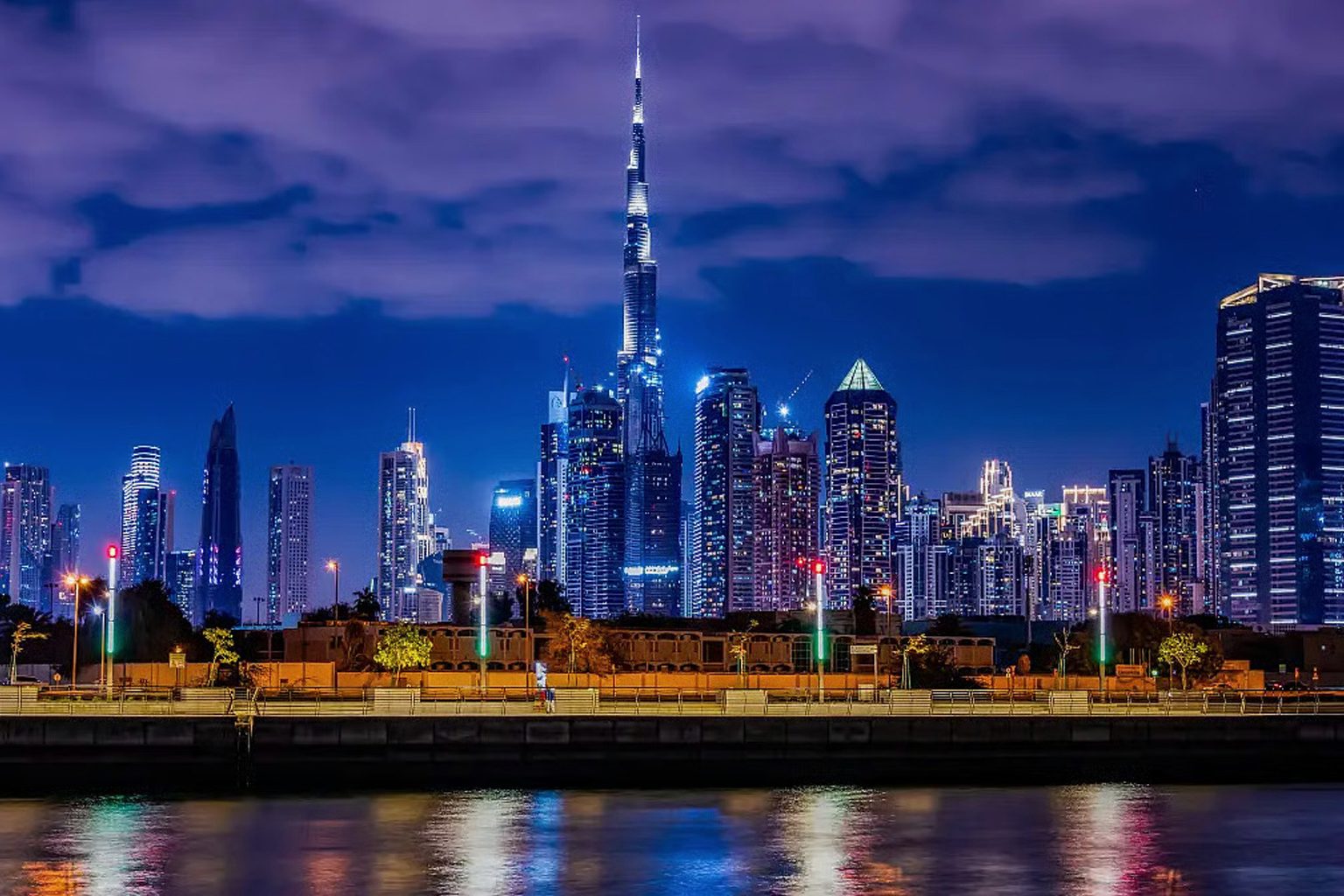 The Burj Khalifa lit at night above the Downtown Dubai skyline